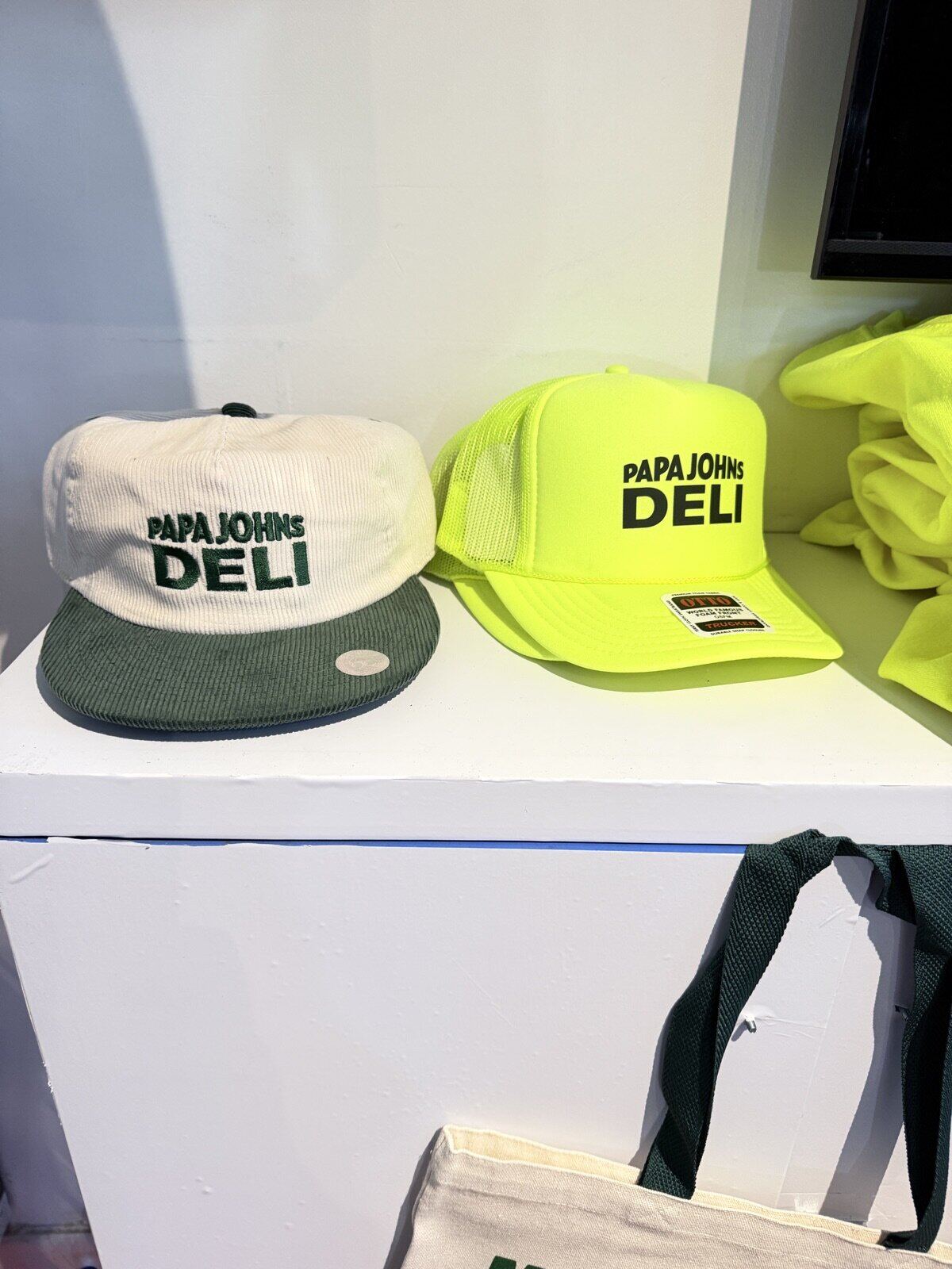 Display of finished printed apparel and merch at a live event